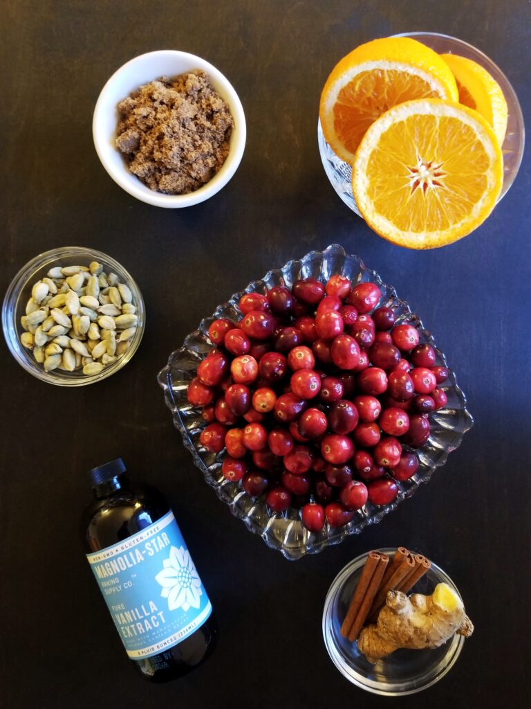 cranberries, oranges, vanilla, brown sugar, and spices for orange cranberry sauce