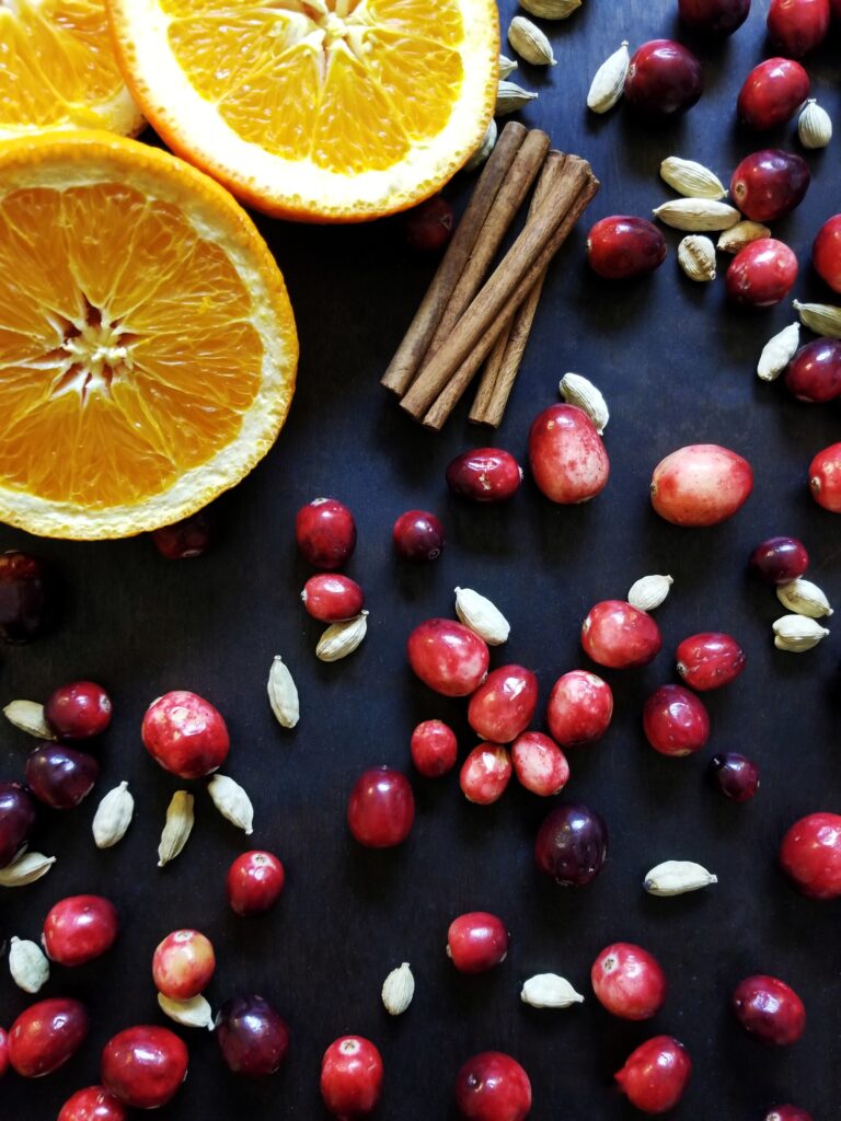 cranberries, oranges, and cinnamon sticks for orange cranberry sauce