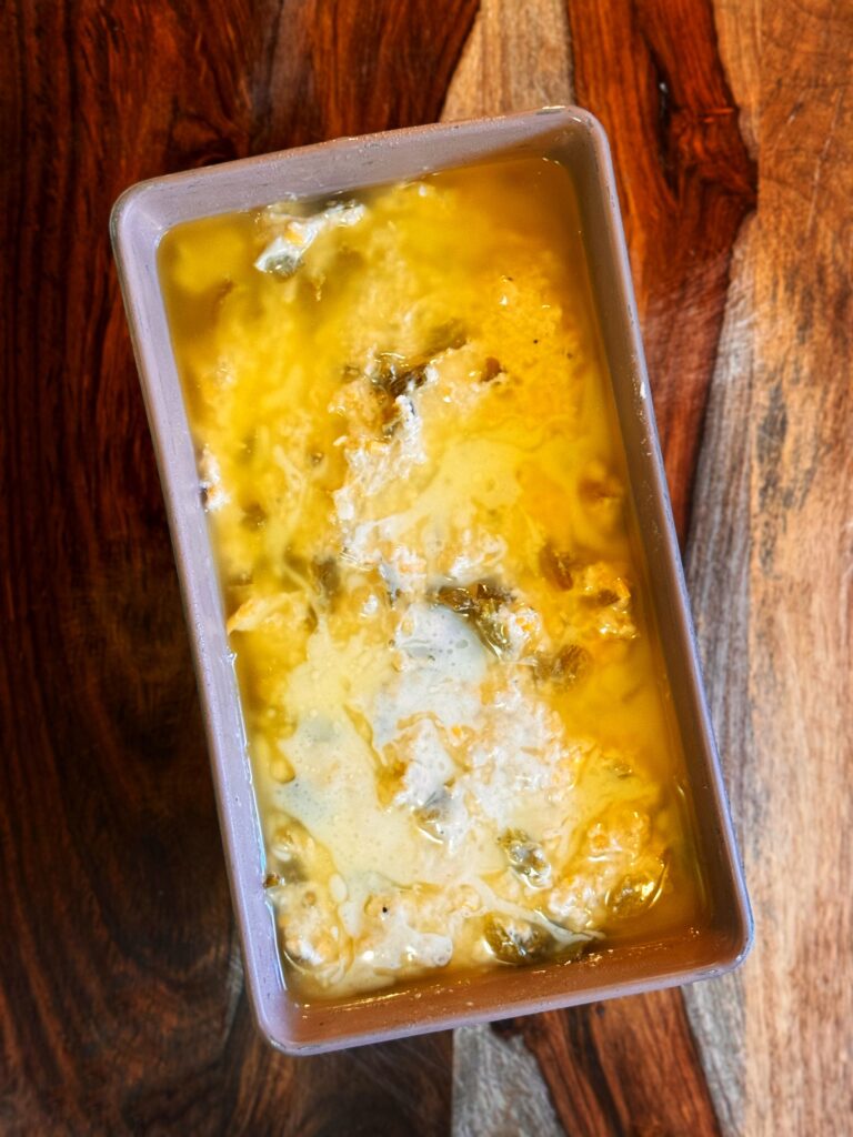 melted butter and cheesy green chile beer bread