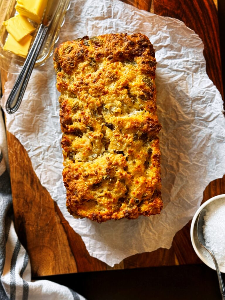 loaf of cheesy green chile beer bread, butter, and flaked sea salt