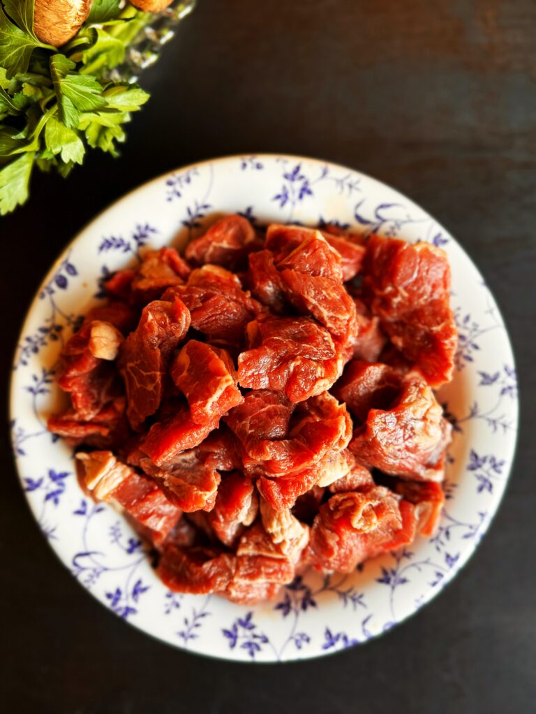 a photo of a bowl of stew meat for beef Guinness stew